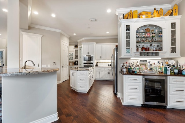 bar featuring a bar, appliances with stainless steel finishes, ornamental molding, and wine cooler