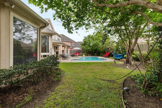 view of yard featuring a fenced in pool, a patio area, and a fenced backyard