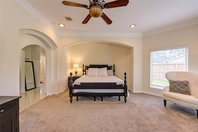 bedroom with visible vents, arched walkways, crown molding, recessed lighting, and light colored carpet