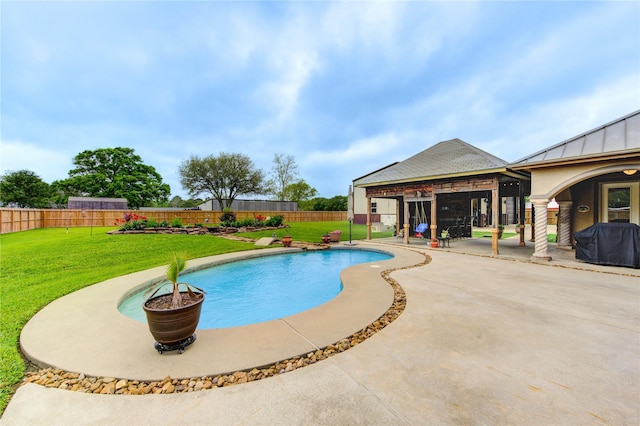 view of pool featuring a fenced in pool, a patio, a grill, a fenced backyard, and a yard