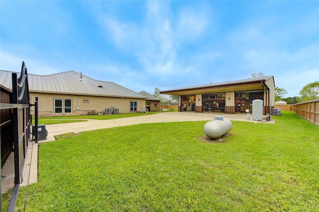 rear view of house with concrete driveway and a garage