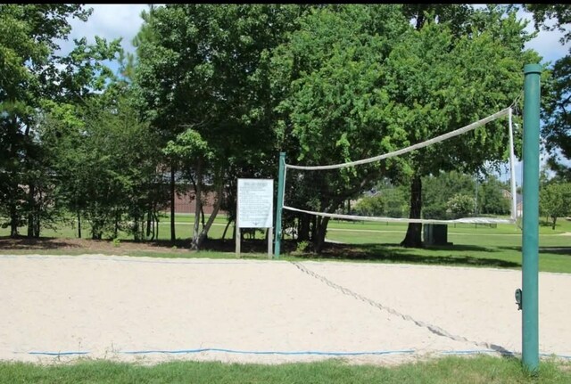 25827 Austin Spgs, Spring, TX 77373 - view of home's community featuring volleyball court and a lawn