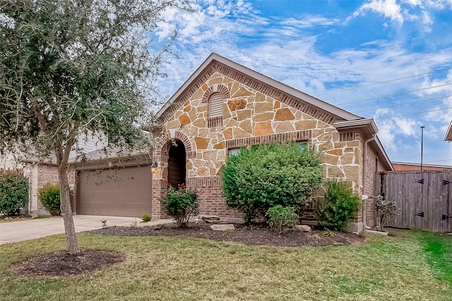 26626 Yukon Straight Dr, Richmond, TX 77406 - view of front facade featuring brick siding, driveway, stone siding, and a garage