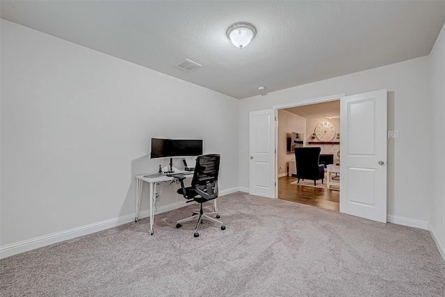 26626 Yukon Straight Dr, Richmond, TX 77406 - home office featuring carpet, visible vents, baseboards, and a textured ceiling