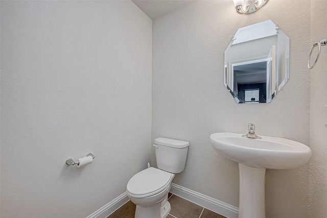 26626 Yukon Straight Dr, Richmond, TX 77406 - half bath featuring toilet, tile patterned flooring, and baseboards