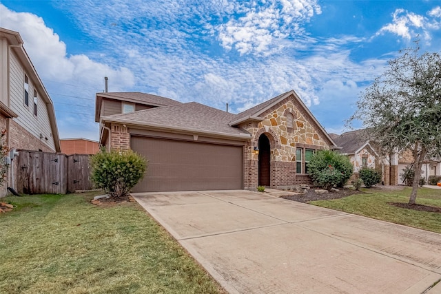 26626 Yukon Straight Dr, Richmond, TX 77406 - view of front of home featuring brick siding, driveway, a front lawn, and an attached garage