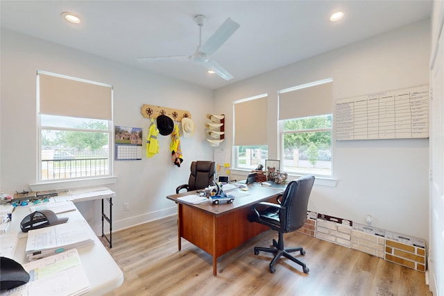 home office with ceiling fan, a wealth of natural light, and wood finished floors