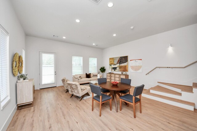 1049 Glenn Ave, Houston, TX 77088 - dining room with light wood finished floors, visible vents, and recessed lighting