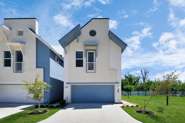 1049 Glenn Ave, Houston, TX 77088 - view of front of house with a front yard, a garage, fence, concrete driveway, and brick siding