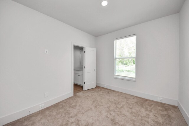 1049 Glenn Ave, Houston, TX 77088 - carpeted spare room with baseboards