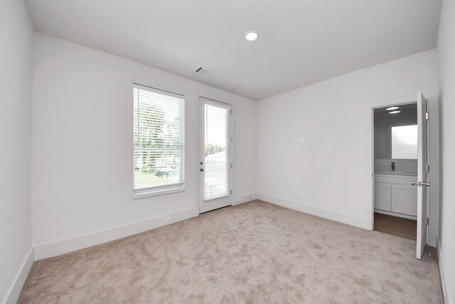 1049 Glenn Ave, Houston, TX 77088 - unfurnished room featuring carpet flooring, visible vents, and baseboards