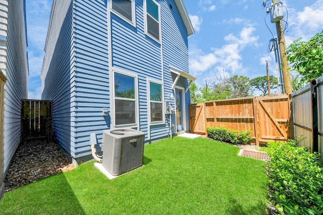 1049 Glenn Ave, Houston, TX 77088 - view of yard with cooling unit, fence, and a gate