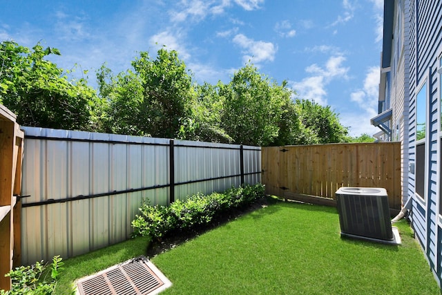 1049 Glenn Ave, Houston, TX 77088 - view of yard featuring central AC unit, a fenced backyard, and visible vents
