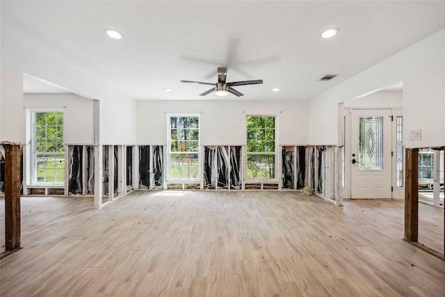 unfurnished living room featuring ceiling fan, wood finished floors, and recessed lighting