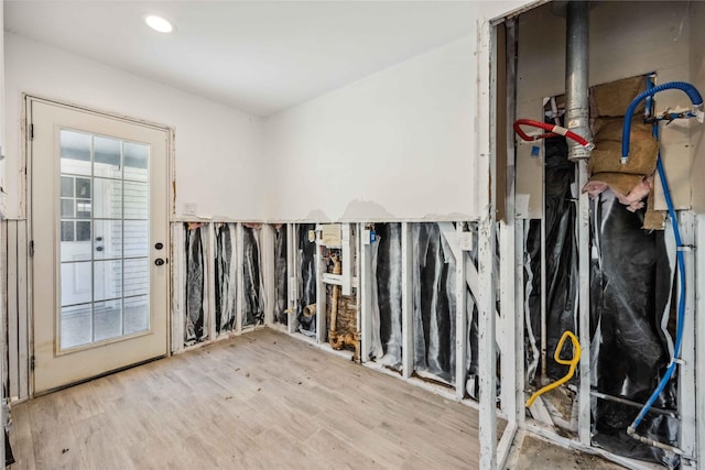 empty room with plenty of natural light and wood finished floors