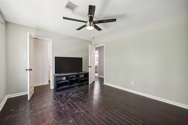 living room with wood-type flooring, visible vents, a ceiling fan, and baseboards