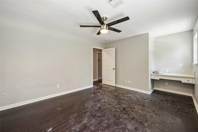 unfurnished bedroom with ceiling fan, baseboards, dark wood-style flooring, and visible vents