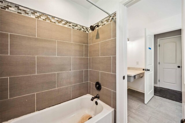 bathroom featuring washtub / shower combination
