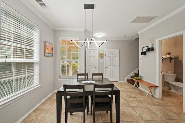 dining room with stairs, crown molding, visible vents, and light tile patterned floors