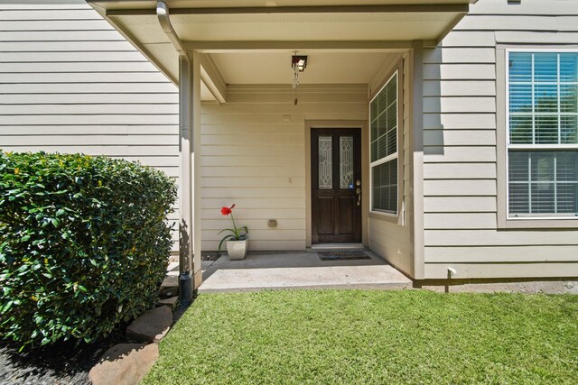 6415 Densberry Ln, Katy, TX 77494 - doorway to property with a yard