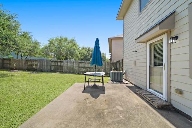 view of patio featuring central AC unit and a fenced backyard
