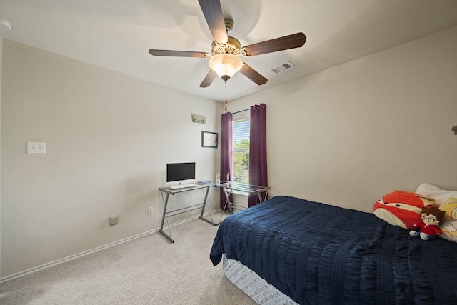 carpeted bedroom featuring a ceiling fan, baseboards, and visible vents