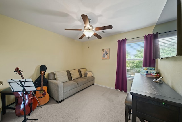 living room with a ceiling fan, baseboards, visible vents, and carpet