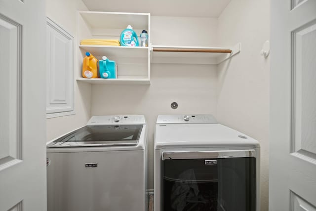 laundry area featuring laundry area and washer and clothes dryer