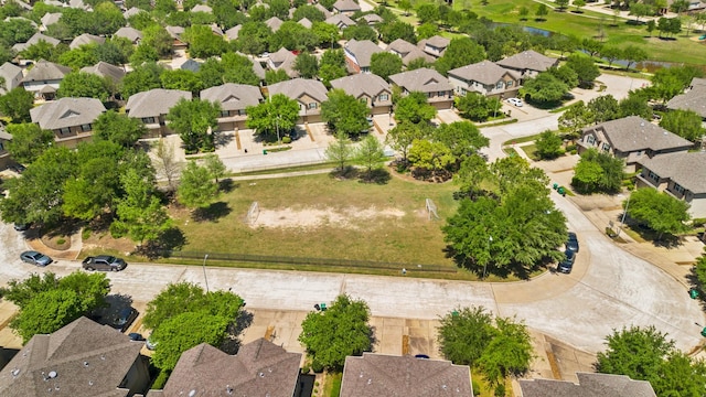 drone / aerial view featuring a water view and a residential view
