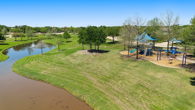 exterior space featuring a lawn, a water view, and playground community