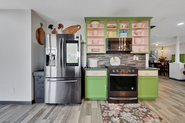 kitchen featuring light wood finished floors, ornate columns, green cabinetry, stainless steel appliances, and open shelves