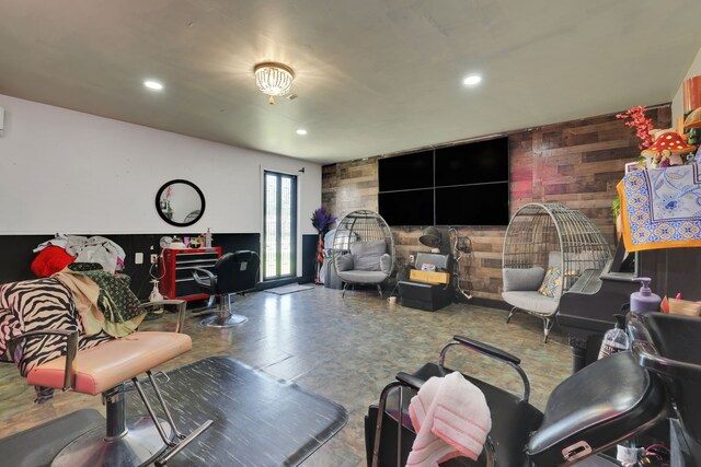 living room with wooden walls and recessed lighting