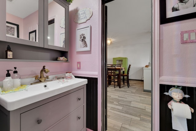 8319 Lemongrass Ave, Baytown, TX 77521 - bathroom featuring wood finished floors and vanity