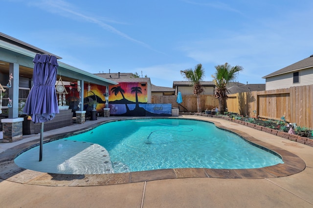view of swimming pool with a fenced backyard, a fenced in pool, and a patio