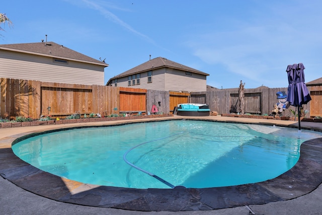 8319 Lemongrass Ave, Baytown, TX 77521 - view of pool with a fenced in pool and a fenced backyard