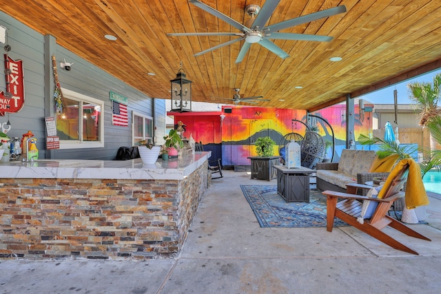 8319 Lemongrass Ave, Baytown, TX 77521 - view of patio featuring a bar, ceiling fan, and a sink