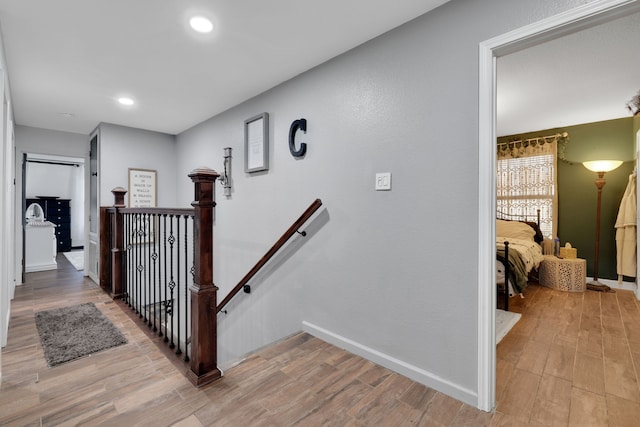 8319 Lemongrass Ave, Baytown, TX 77521 - stairway with recessed lighting, baseboards, and wood finished floors