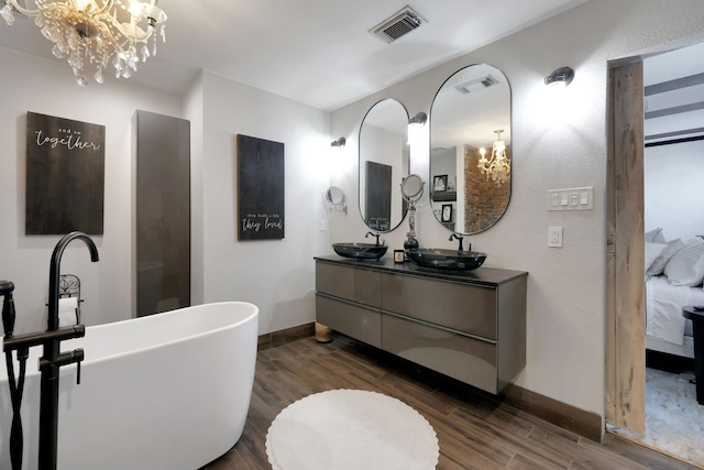 8319 Lemongrass Ave, Baytown, TX 77521 - full bathroom featuring a sink, a notable chandelier, and visible vents