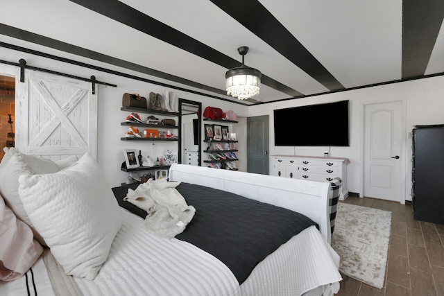8319 Lemongrass Ave, Baytown, TX 77521 - bedroom featuring an inviting chandelier, wood finish floors, and a barn door