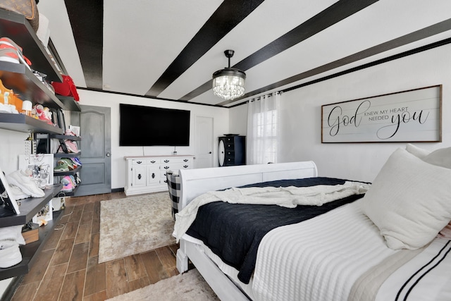 8319 Lemongrass Ave, Baytown, TX 77521 - bedroom featuring dark wood-style flooring and a notable chandelier