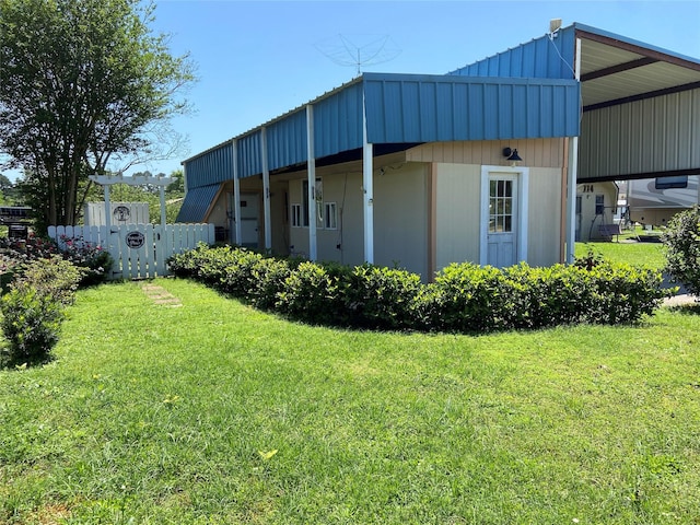 exterior space with a yard and fence