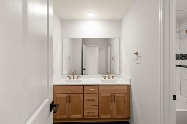 bathroom featuring double vanity and a sink