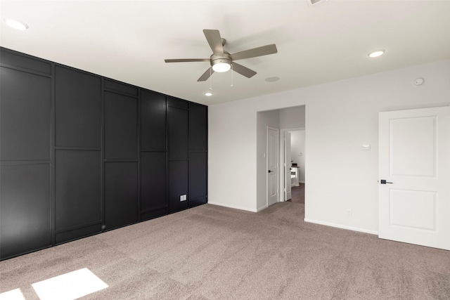unfurnished bedroom featuring light carpet, ceiling fan, baseboards, and recessed lighting