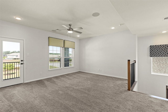 empty room featuring carpet floors, a ceiling fan, and recessed lighting