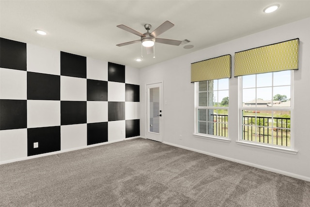 spare room with carpet flooring, baseboards, a ceiling fan, and recessed lighting