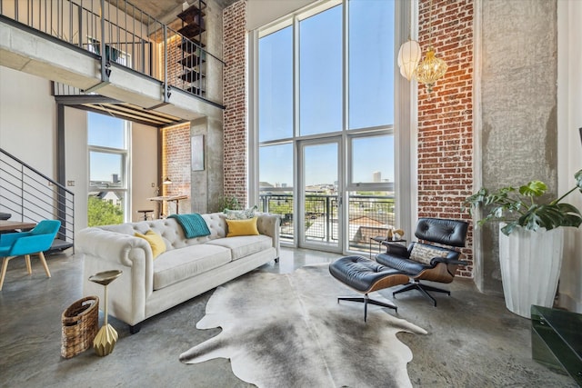 2000 Bagby St Unit 5400, Houston, TX 77002 - living room with a towering ceiling, plenty of natural light, concrete floors, a chandelier, and stairway