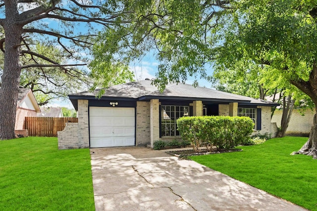 ranch-style house with a garage, fence, concrete driveway, and a front lawn