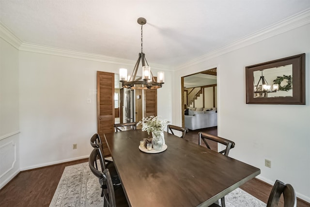 dining room with stairs, ornamental molding, a chandelier, and dark wood-type flooring