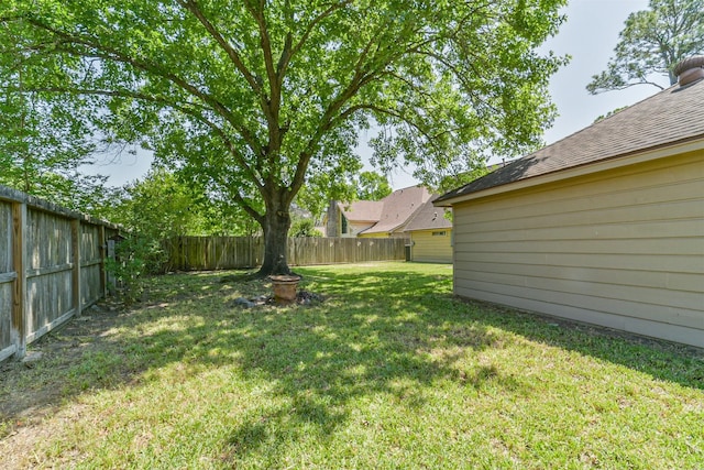 view of yard with a fenced backyard