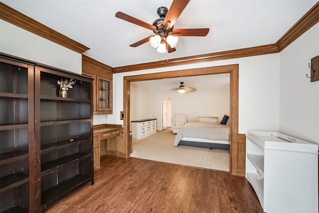 bedroom with dark wood-style floors and crown molding